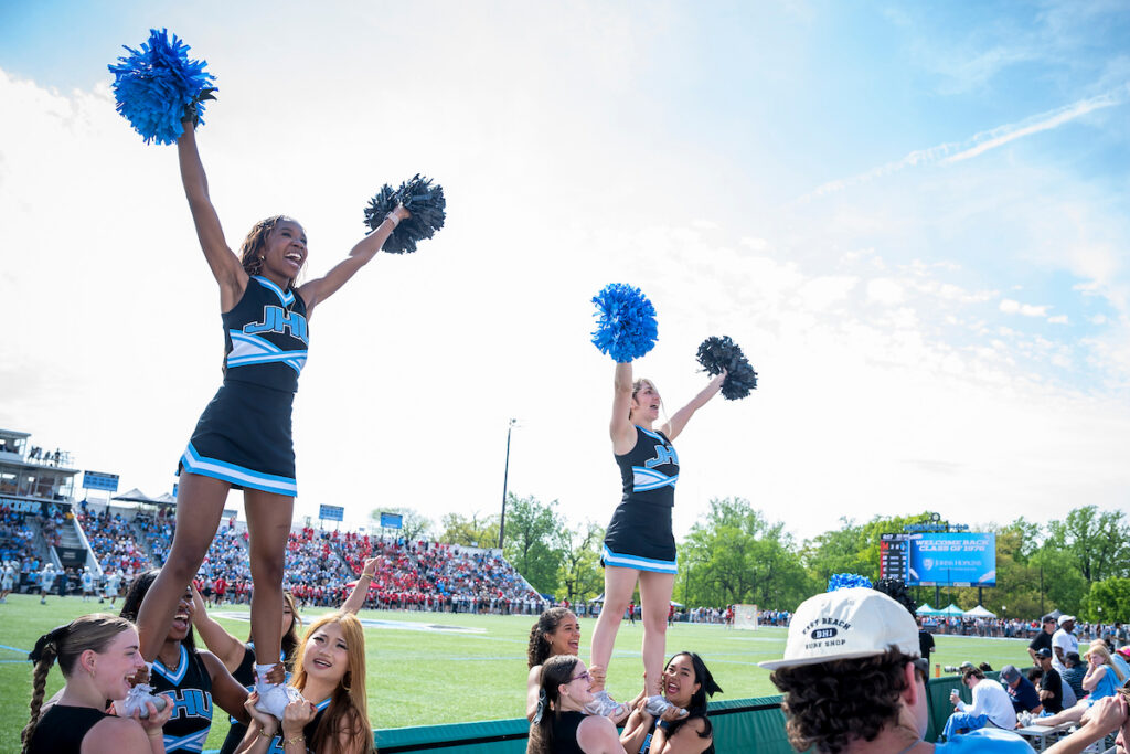 Hopkins cheerleaders performing stunts