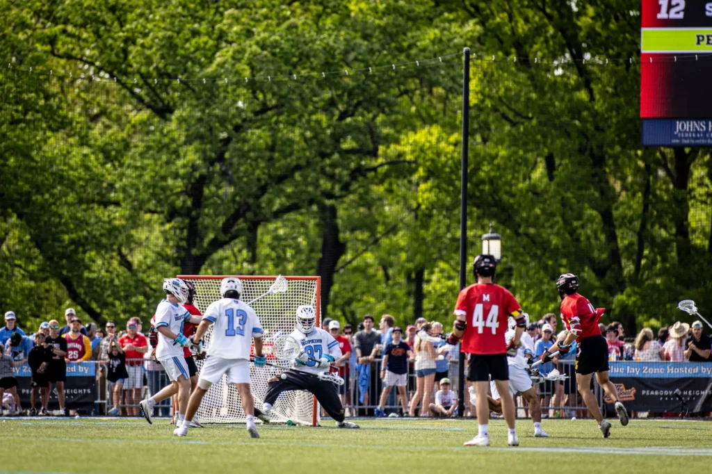 Hopkins men's lacrosse goalie makes a save